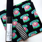 A roll of black vinyl with a white label reading 'sewhungnipple' is displayed next to a matching black and white striped webbing plus fabric in a retro rotary phone pattern in teal, pink, and gold