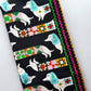 Ruby Star Society dachshund print fabric with colorful geometric patterns and multicolor ric rac trim for sewing.