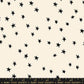 Cream-colored fabric with a scattered pattern of small, hand-drawn black stars, featuring a Ruby Star Society measuring ruler at the bottom edge.
