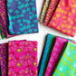 Collection of colorful patterned fabric swatches on a white background
