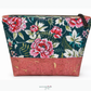 Pink floral fabric on dark green background paired with a pink and gold flecked cork fabric roll for sewing and bag making.