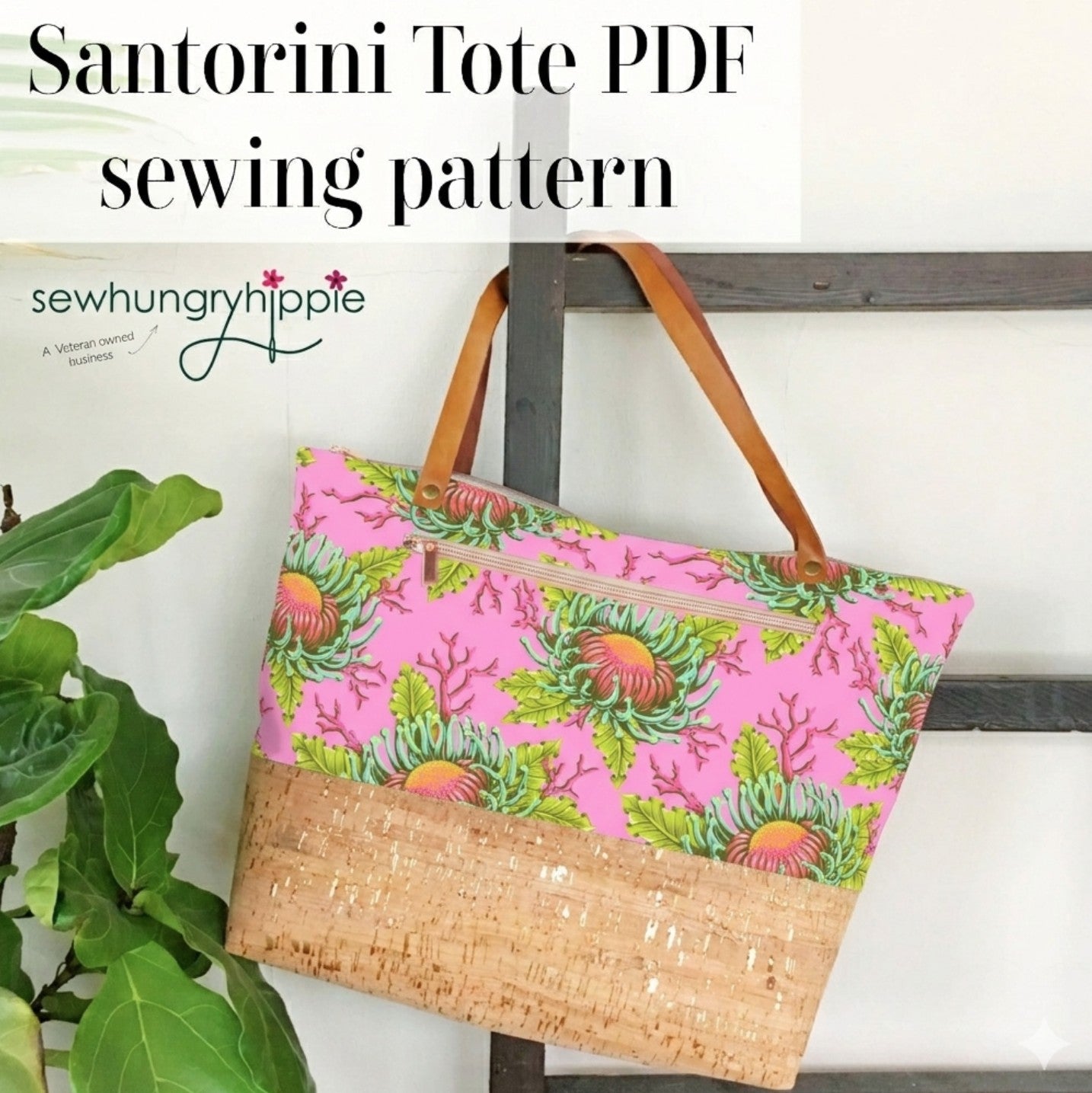 Santorini tote bag with pink floral pattern and woven base, hanging on a rack with 'sewhungryhippie' branding.