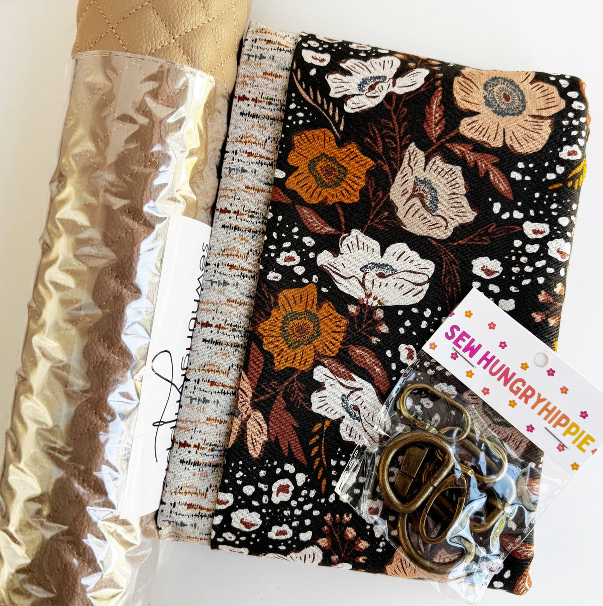 Sew Hungry Hippie DIY bag-making kit featuring coordinating bronze hardware, printed vinyl, and fabric for making a handmade bag