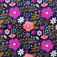 Close-up of Sew Hungry Hippie navy pink chamomile floral canvas fabric for bag making