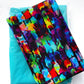 Colorful abstract brushstroke fabric in vibrant blue, purple, pink, green and red paired with turquoise fabric from Sew Hungry Hippie