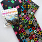 Colorful geometric patterned fabric with black bag hardware from Sew Hungry Hippie