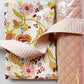 Floral fabric bundle with pink flowers, red berries, mustard leaves, blush pink quilted vinyl, and blush pink patterned webbing
