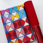 Blue geometric patterned fabric paired with red textured faux leather from Sew Hungry Hippie