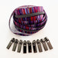 Striped zipper and metal sliders on a white background