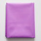 Folded purple fabric on a light gray background