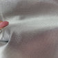 Silver shimmer cotton blend fabric with structured body shown in close-up texture, large precut 36 x 58 inch bag making material