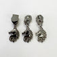 Three silver-toned unicorn-shaped zipper pulls with shield-shaped posts, arranged side by side on a plain white background.