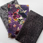Spooky Halloween fabric bundle with skulls, ravens, flowers, mushrooms, owls, and dark patterns for sewing and bag making.