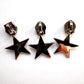 Three star-shaped zipper pulls zipper heads on a white background