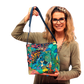 Woman holding handmade Stevie bag showcasing size and structure of finished tote design