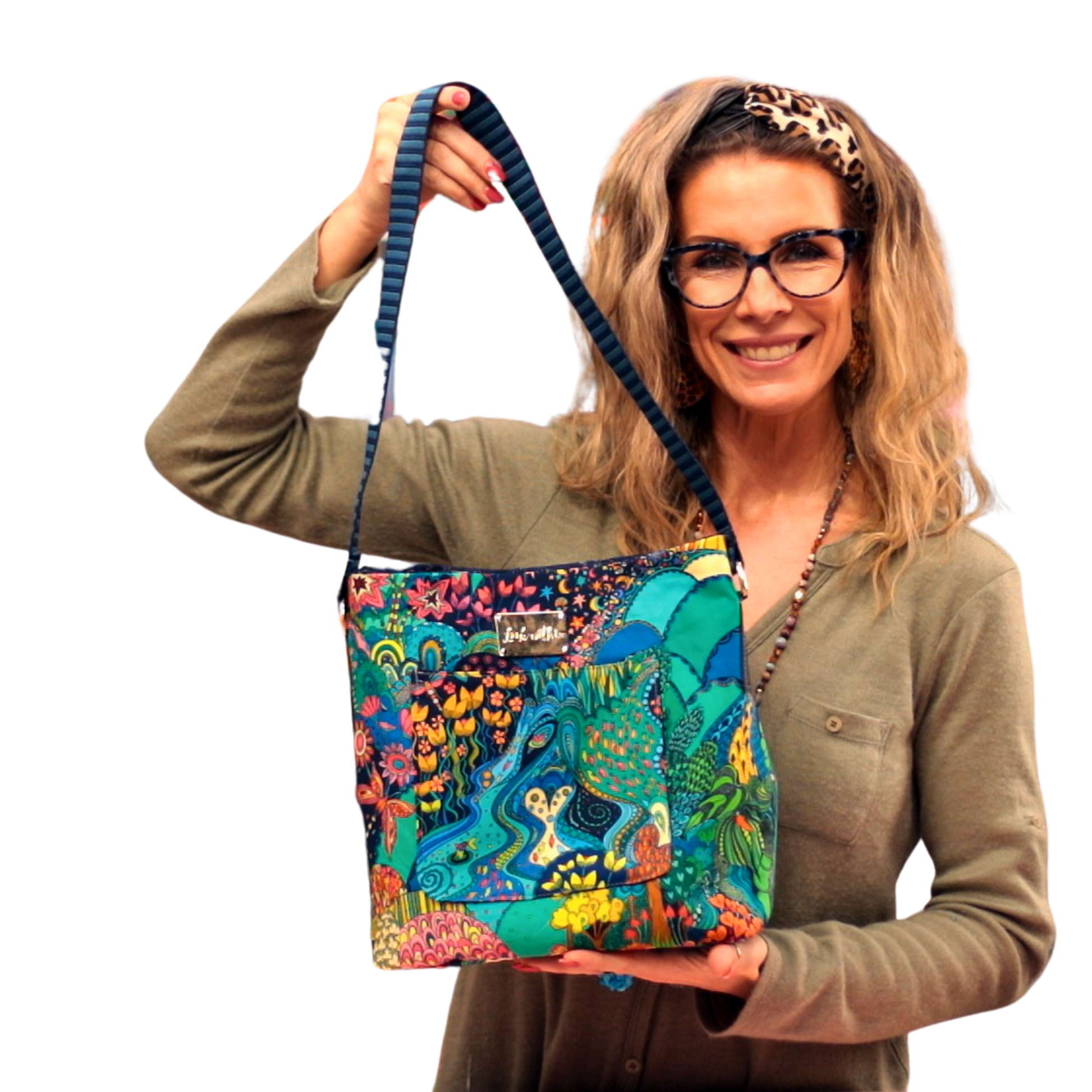 Woman holding handmade Stevie bag showcasing size and structure of finished tote design