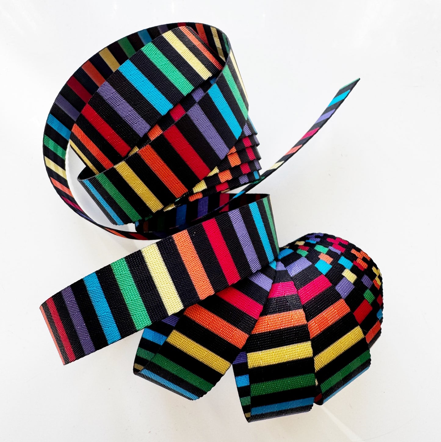 Colorful striped webbing on a white background