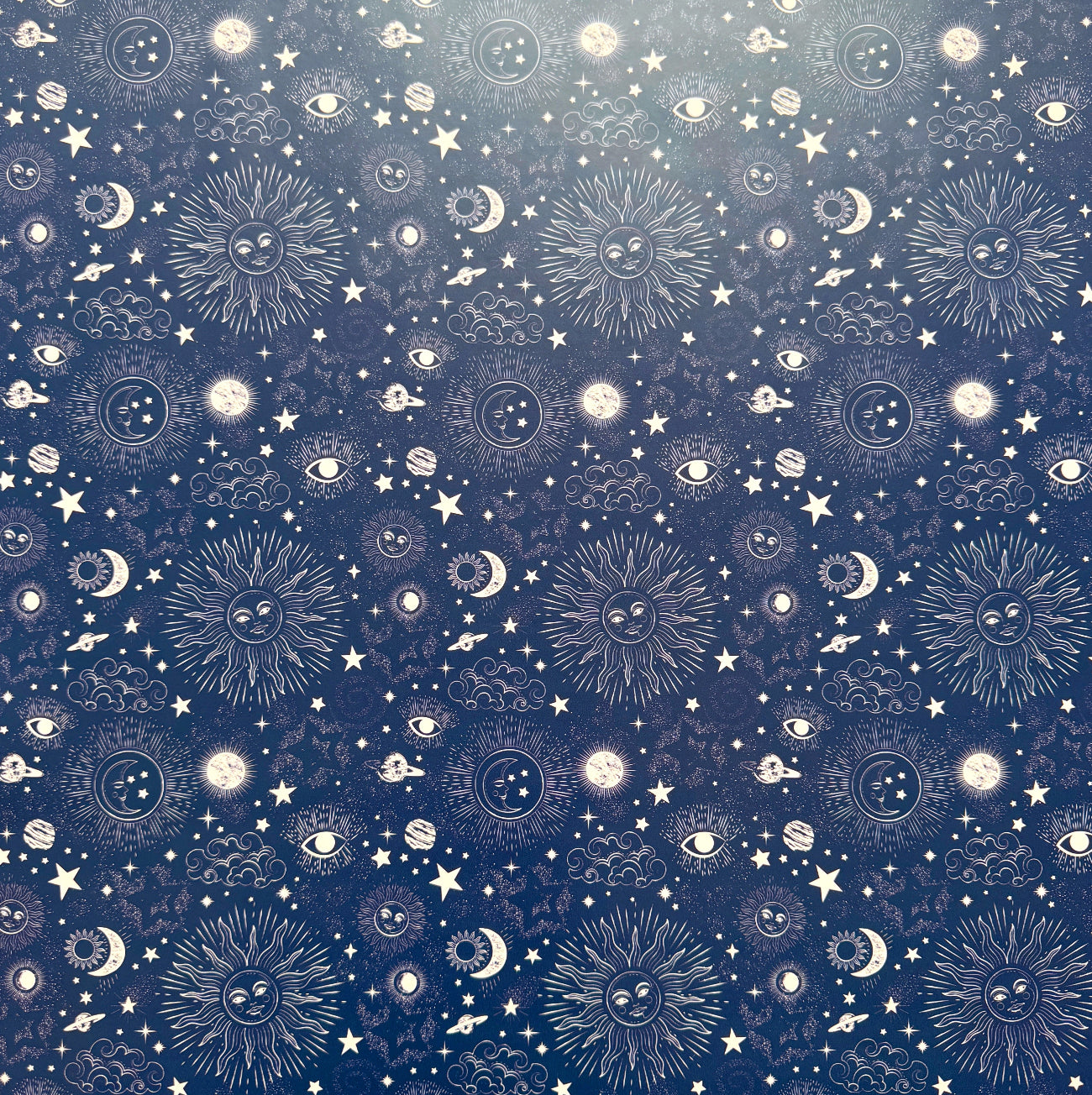 Pattern of celestial elements on a blue background