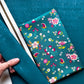 Teal cork fabric for sewing bags with coordinating fabric and zipper tape