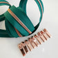 Green zipper with rose gold teeth and pulls
