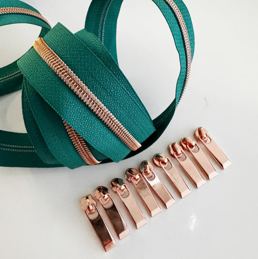 Green zipper with rose gold teeth and pulls