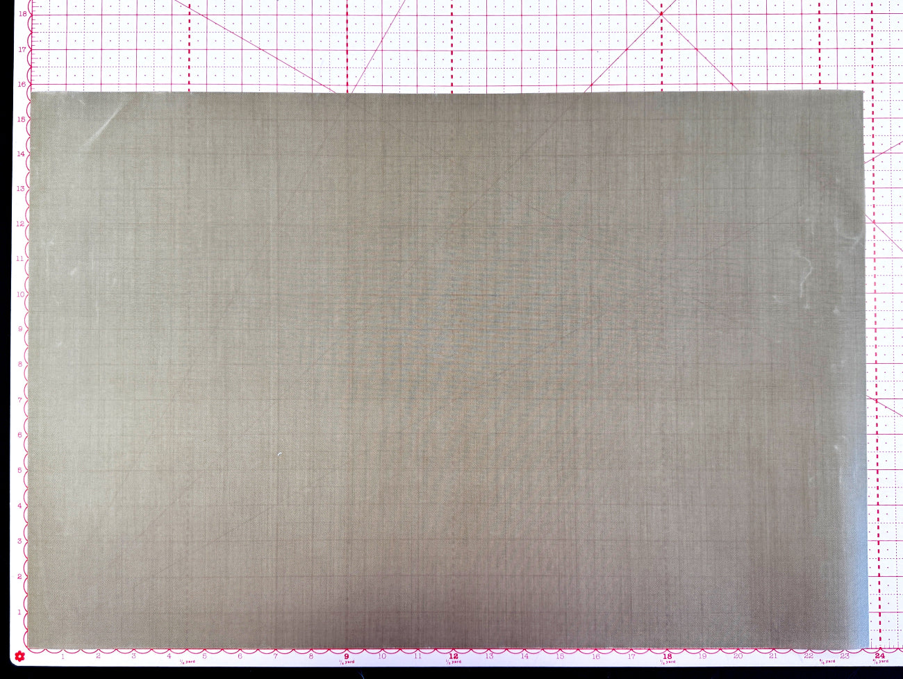 Metallic sheet on a grid background