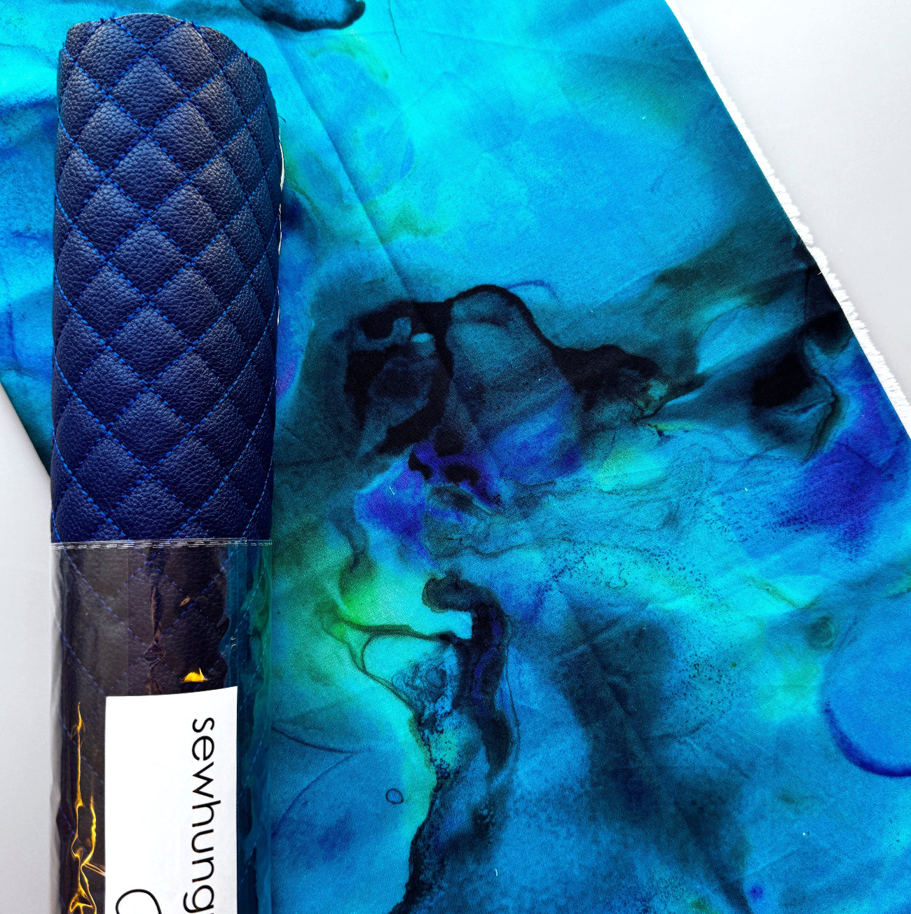 1 yard Tim Holtz fabric with royal blue pebbled quilted vinyl for bag making