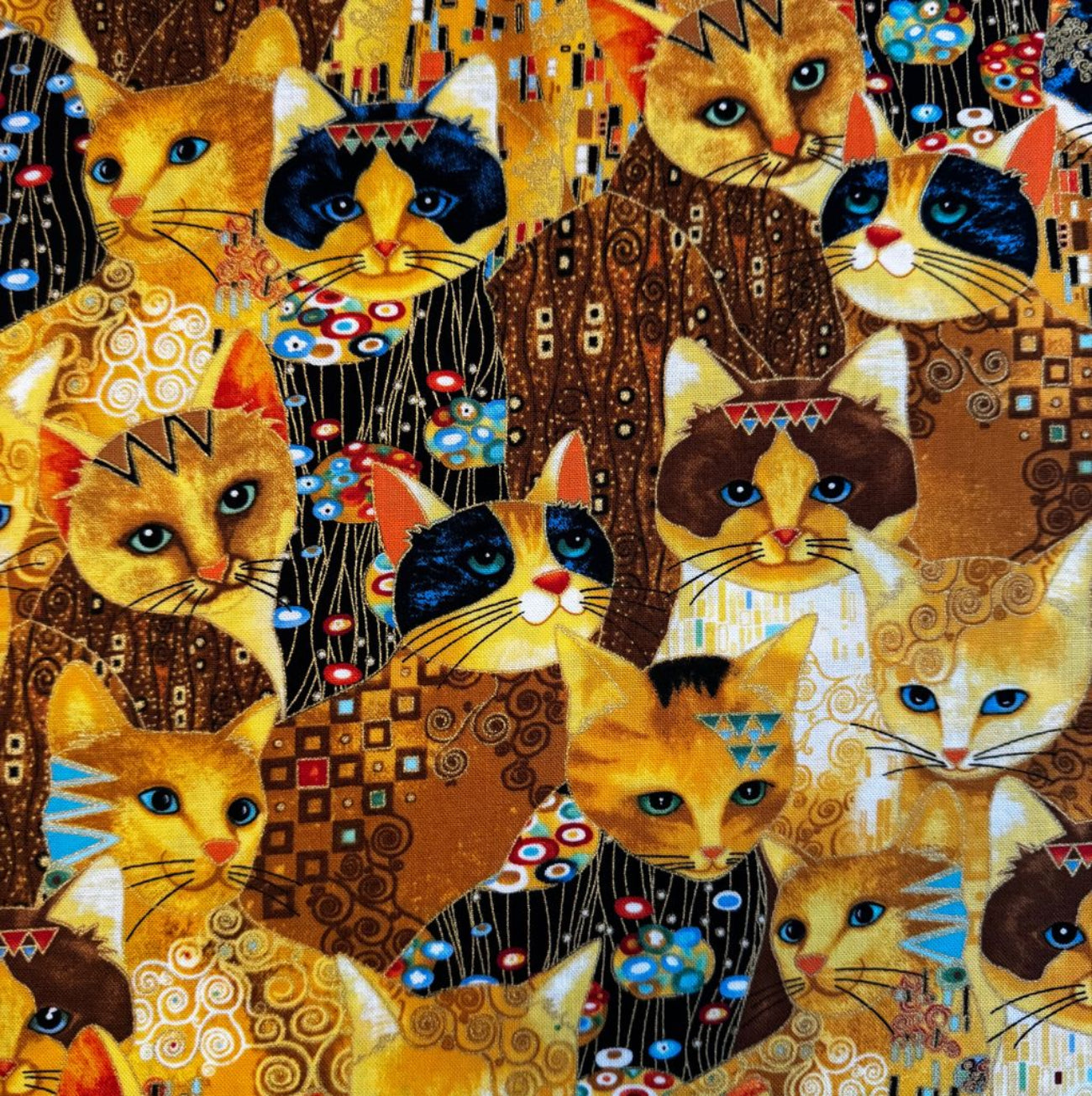 Timeless Treasures Gustav Klimt inspired cat cotton fabric print with gold metallic accents for quilting and sewing.