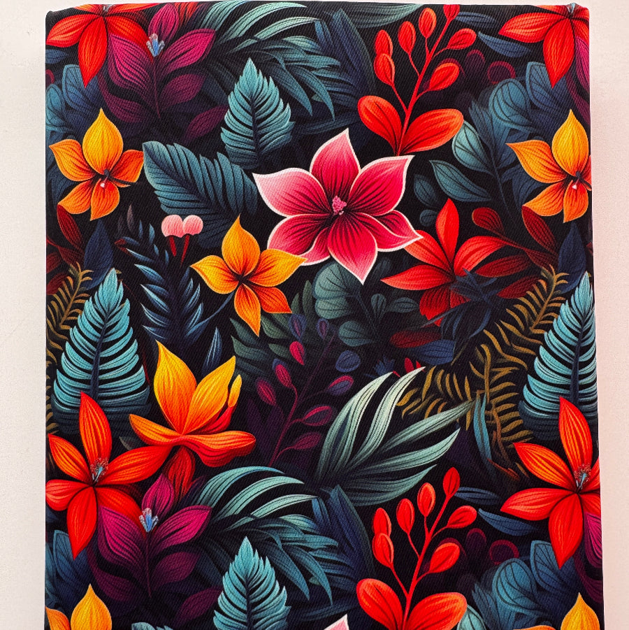 A square canvas print featuring a vibrant tropical floral pattern with red, orange, pink, and teal leaves on a dark background.