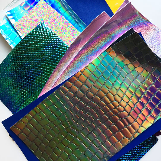 Collection of colorful metallic sheets on a white background