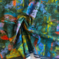 Colorful abstract fabric with a brand label on a textured background