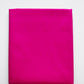Folded bright pink fabric on a white background