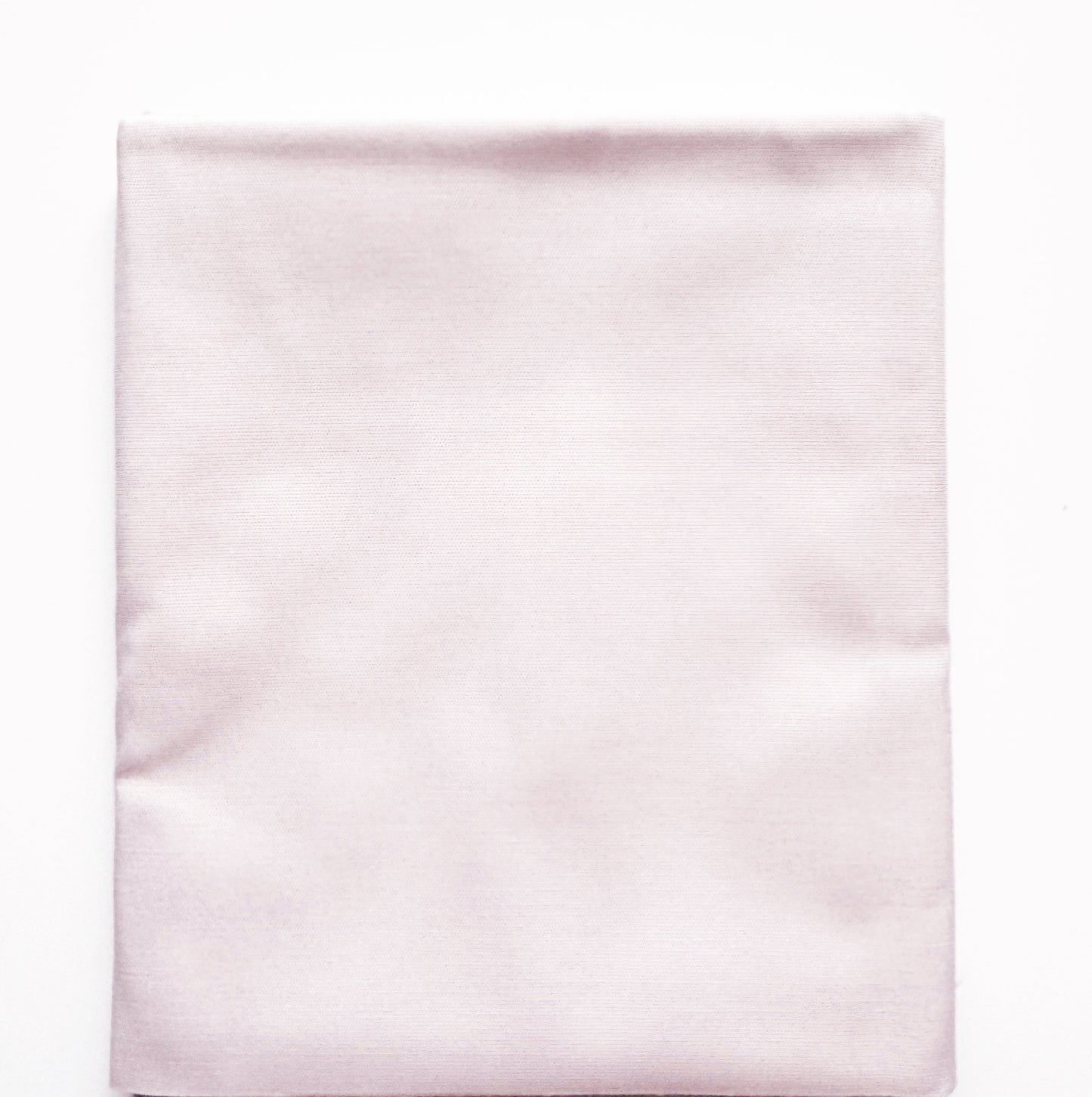 Light pink satin fabric on a white background