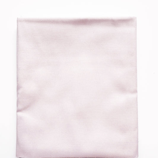 Light pink satin fabric on a white background
