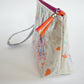 Cosmetic bag with colorful print and tassel detail
