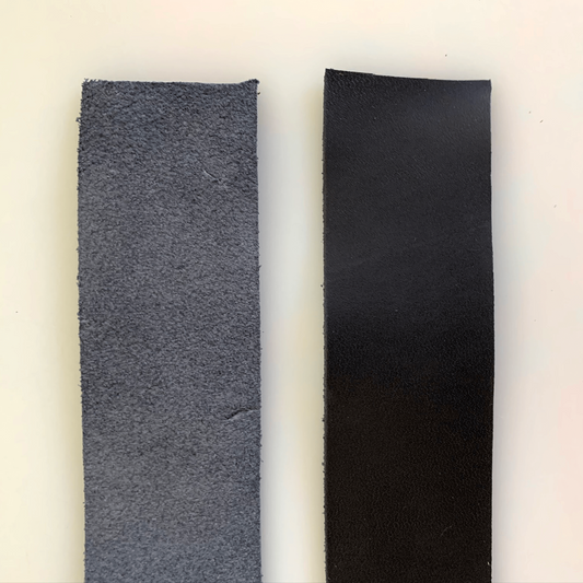 Two strips of leather, one rough and gray, one smooth and black.