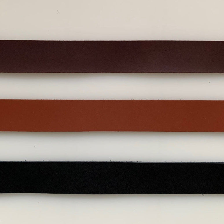 Leather belt samples in brown, tan, and black