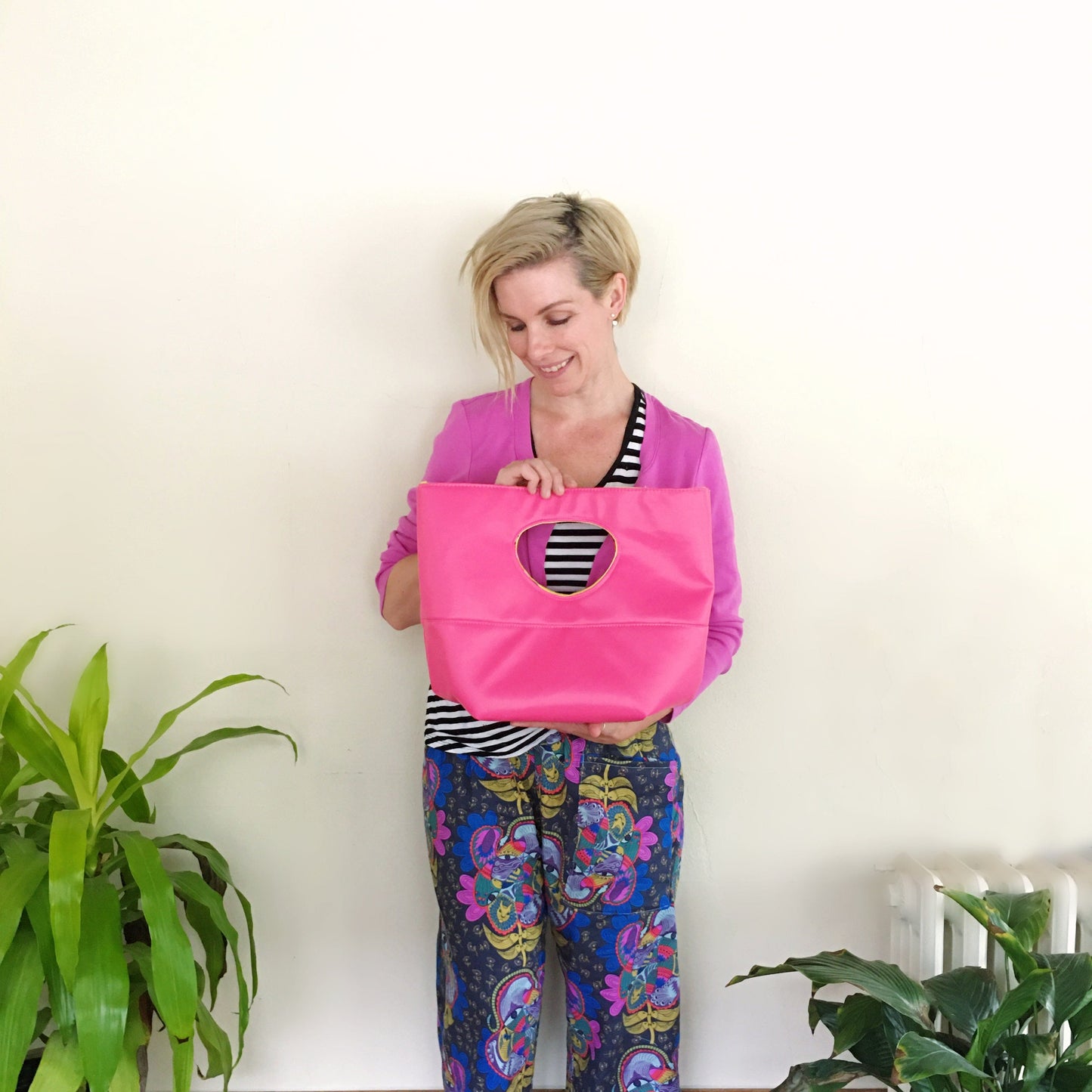 Natalie holding pink tote bag