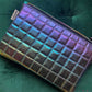 Quilted zipper pouch in Deep Space metallic soft vinyl with a purple and green sheen