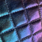 Quilted, iridescent faux leather texture.