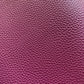 Magenta plum pebbled faux leather vinyl fabric with fine litchi grain texture