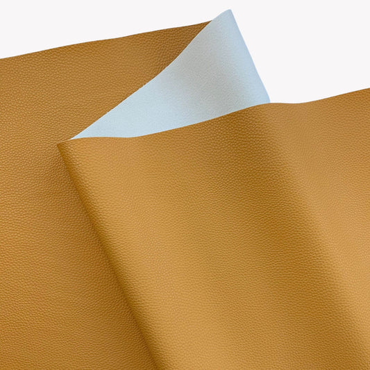 Moonglow Mustard pebbled vinyl faux leather fabric with soft light backing