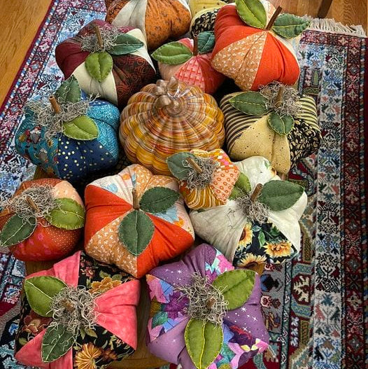 DelWehner's handmade fabric pumpkins on rug