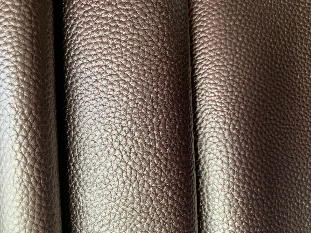 Close-up of textured brown leather folds.