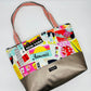 Tote in colorful city print with a taupe vinyl base