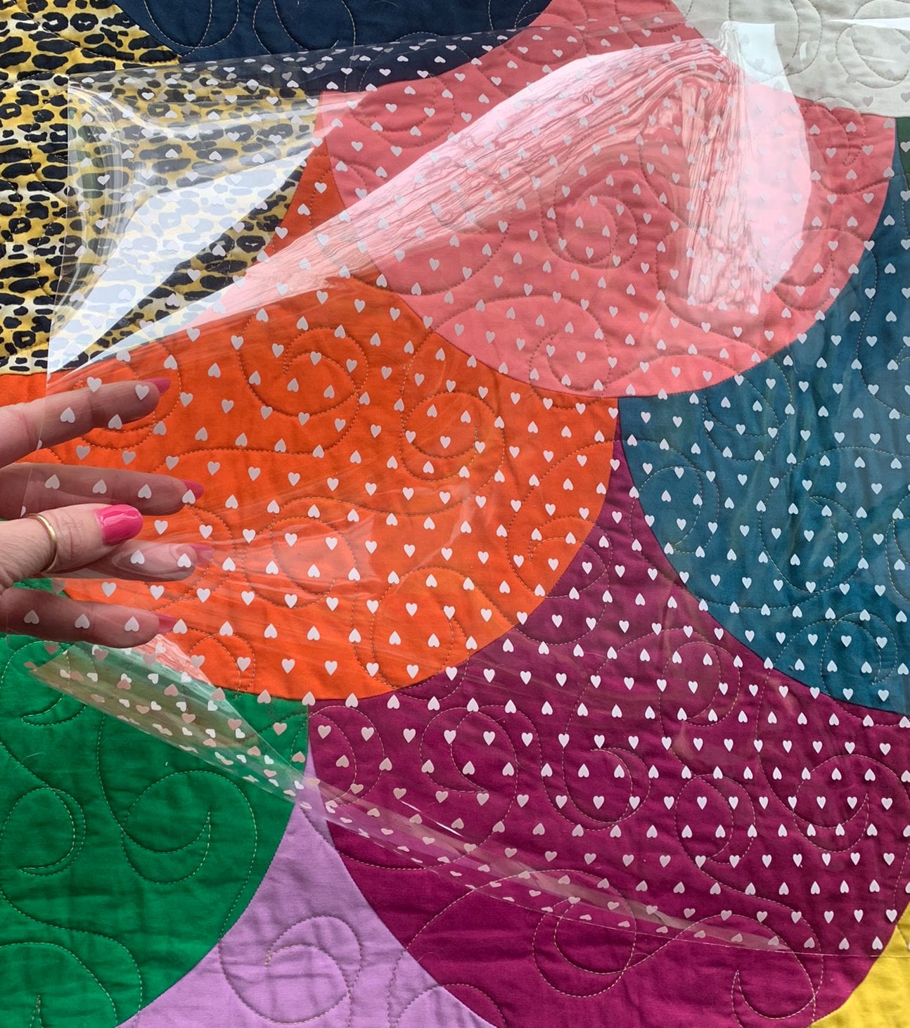 White heart vinyl hippie quilt with colorful heart pattern